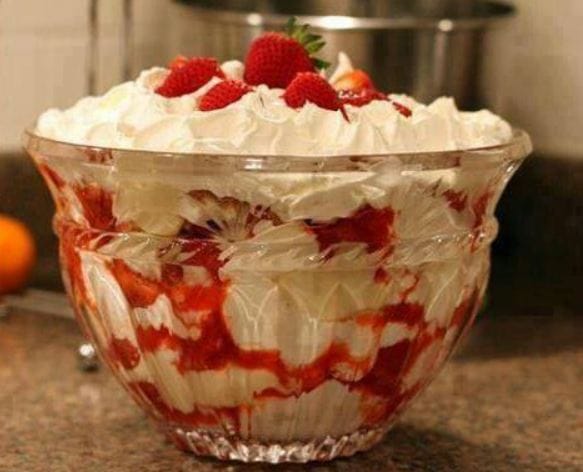 Southern Strawberry Punch Bowl Cake - A delightful dessert with layers of cake, strawberries, and whipped topping.
