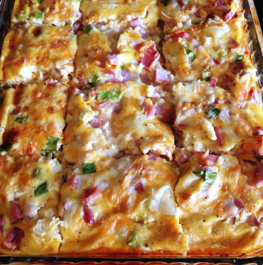 "Farmer's Breakfast Casserole - A delightful medley of eggs, potatoes, bacon, and vegetables in a baking dish."