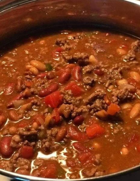 Homemade Wendy's Chili in a bowl, showcasing the rich blend of fresh ground beef, tomatoes, beans, and aromatic spices."