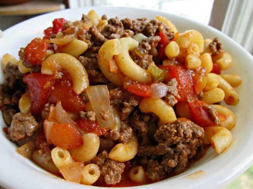 "Bowl of Old Fashioned Goulash with Beef, Vegetables, and Herbs"