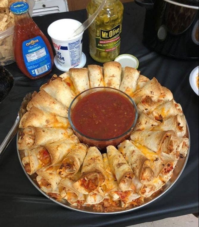 A beautiful quesadilla ring made with layers of tortillas and cheese, served on a platter
