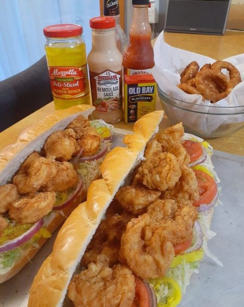 New Orleans Style Shrimp Po' Boy - Crispy fried shrimp on French bread with lettuce, tomato, and pickles