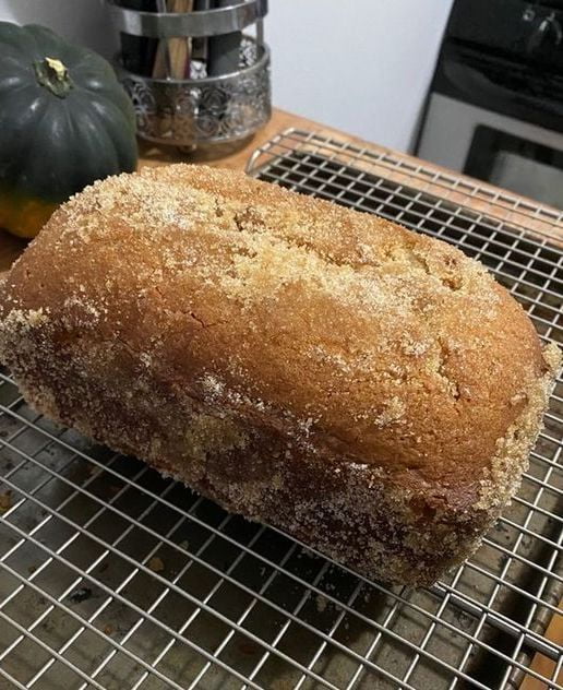 Cinnamon Bread loaf on a wooden cutting board