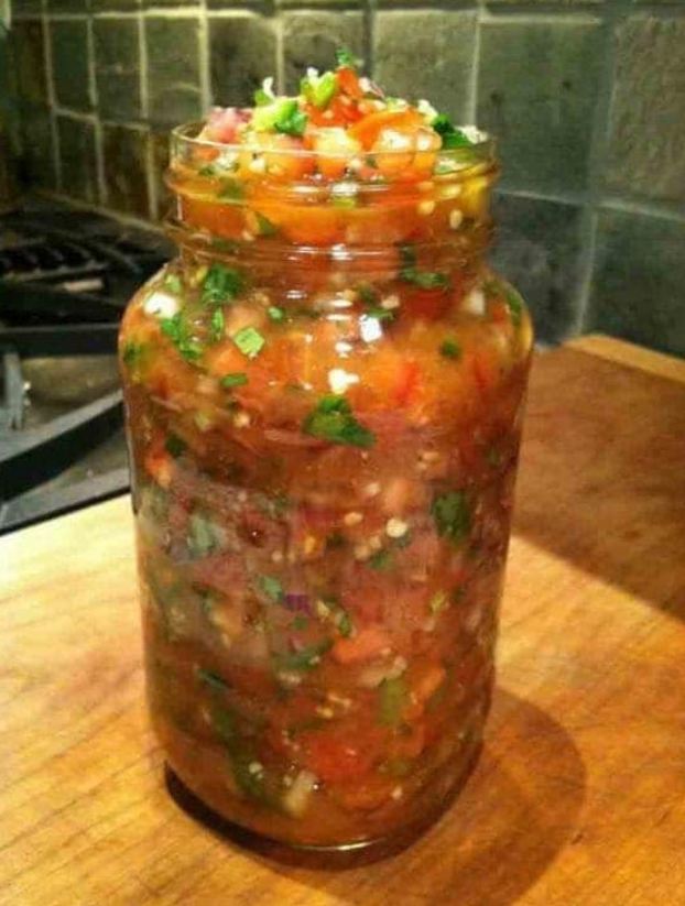 Image of a bowl of Pico de Gallo with diced tomatoes, onions, cilantro, and jalapeño peppers.