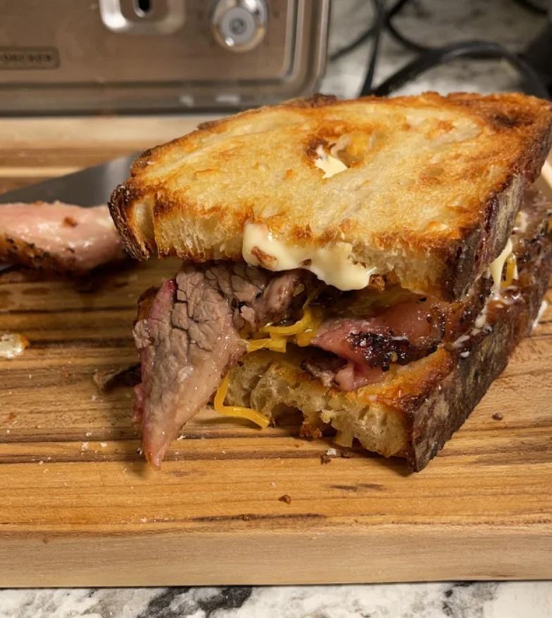 12 hour oak smoked brisket sandwich on freshly baked and toasted cheese