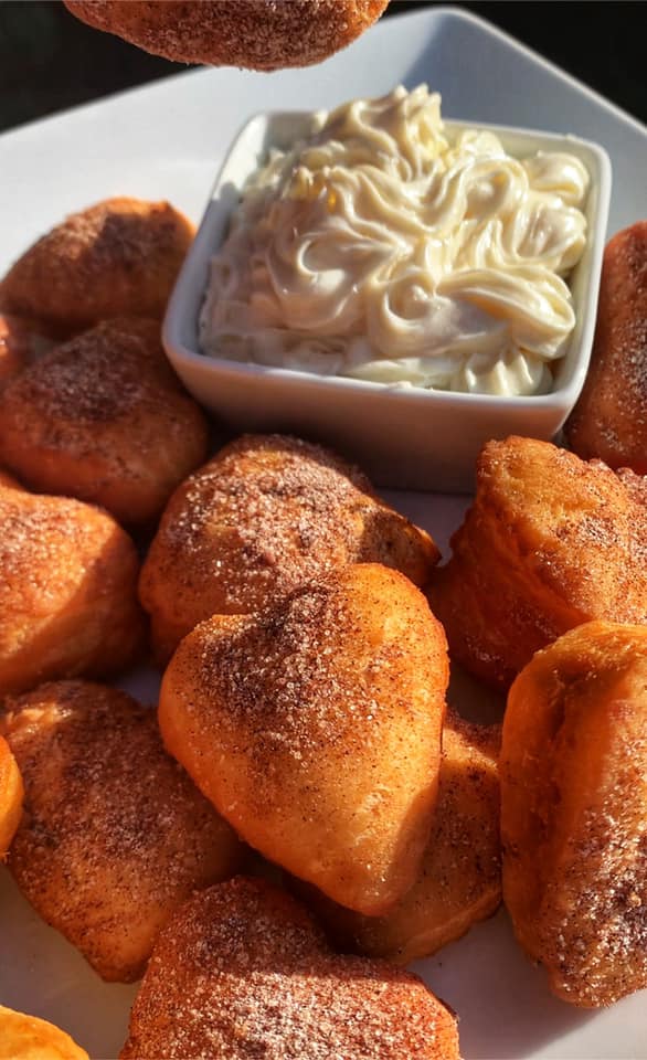 Step-by-step instructions for making heart-shaped cinnamon and powdered sugar donuts at home