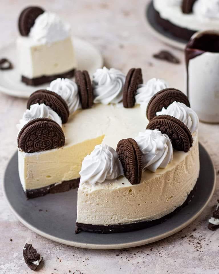 A slice of Oreo Cheesecake on a plate
