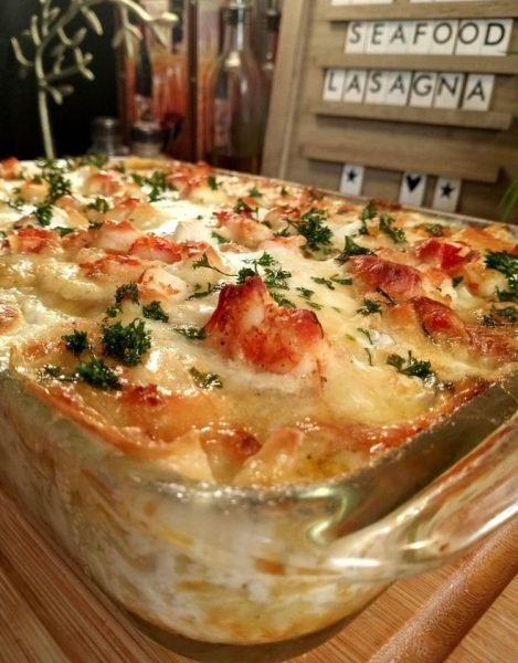 Seafood Lasagna: Layers of fresh pasta, creamy bechamel, and a mix of crab, shrimp, scallops, and calamari topped with melted mozzarella