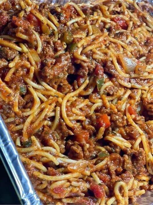 Linda's Slow Cooker Spaghetti - Aromatic meat sauce simmered to perfection, served over al dente spaghetti.