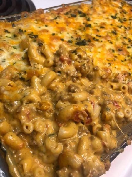 A skillet of homemade hamburger helper with ground beef, macaroni, and cheese