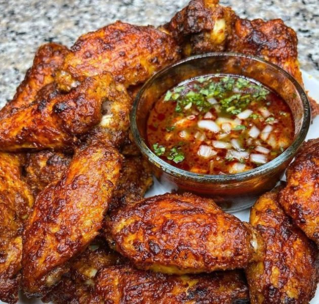 A plate of Birria Wings with Consome, a Mexican-inspired recipe with a spicy kick