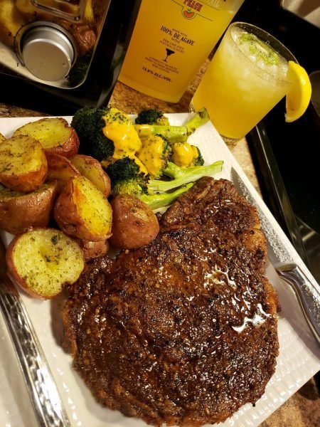 A photo of roasted steak and potatoes on a plate.