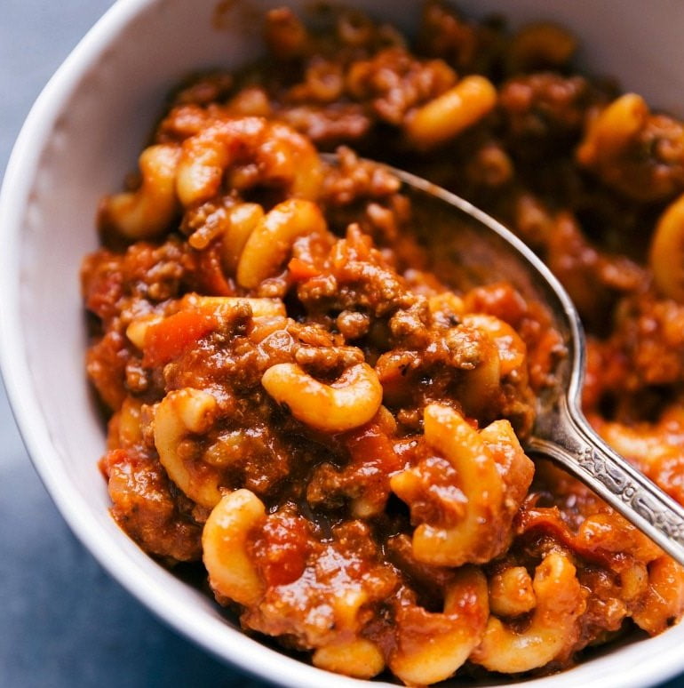 "Creamy and Cheesy Beef Goulash: A tempting bowl of goulash featuring succulent beef, aromatic spices, and a generous topping of melted cheese."