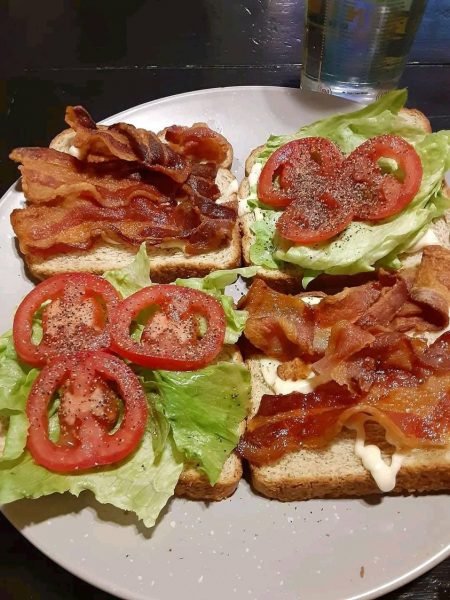 Fried Egg BLT Sandwich – A decadent masterpiece featuring crispy bacon, fresh lettuce, juicy tomato, and a runny yolk fried egg on toasted French bread.