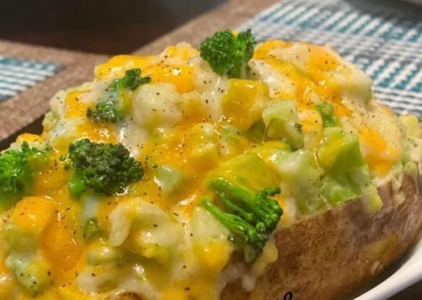 Baked Potatoes with Broccoli & Cheese Sauce - A visually stunning dish featuring perfectly baked russet potatoes, fresh broccoli florets, and a luscious cheese sauce.