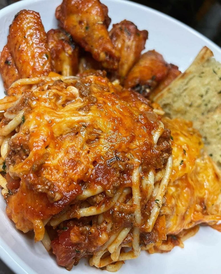 Cheesy Spaghetti, Old Bay Wings, and Garlic Bread - Culinary Trio on a Platter