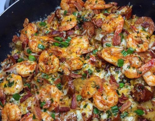 Image of buttered garlic potatoes with sautéed onions and peppers