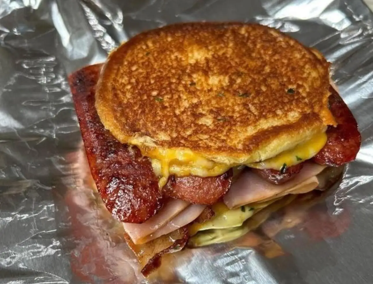 Sausage bacon egg and cheese sandwich
