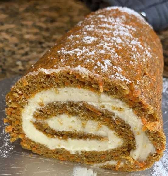 "Carrot Cake Roll with Cream Cheese Filling - Moist cake filled with cream cheese, rolled into a delightful treat"