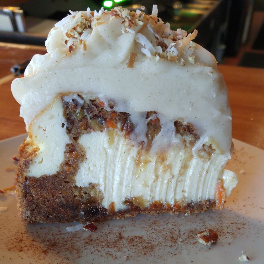 Delicious carrot cake cheesecake cake with a creamy cheesecake layer on top