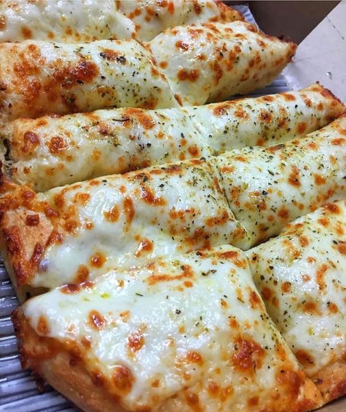 Cheesy Garlic Breadsticks on a Plate