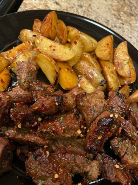 Garlic Butter Steak and Potatoes Skillet - Delicious steak and potatoes cooked in a skillet with garlic butter sauce.