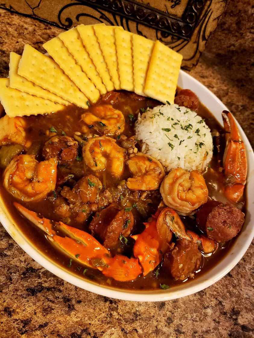 A bowl of homemade GUMBO with shrimp, sausage and vegetables