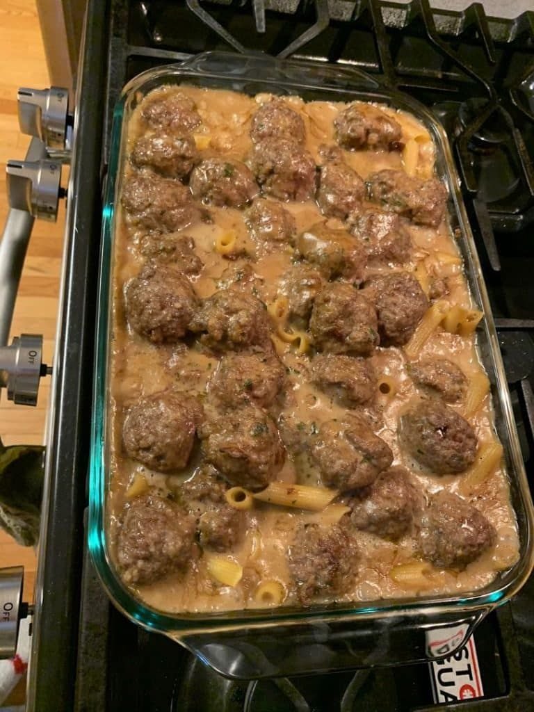 Golden-brown baked SWEDISH MEATBALL NOODLE BAKE with Parmesan cheese topping.