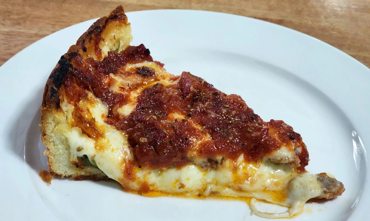 Malnatti-style Chicago deep dish pizza on a white plate