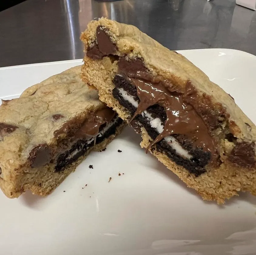 Oreo-stuffed chocolate chip cookies on a baking sheet