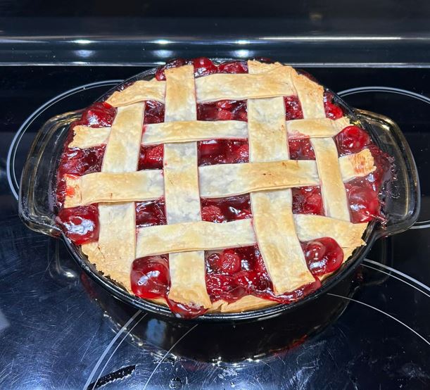 A photo of a cherry pie in a pie dish