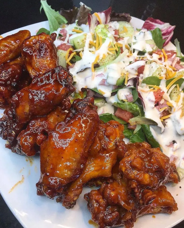 Delicious hot wings with honey Sriracha sauce