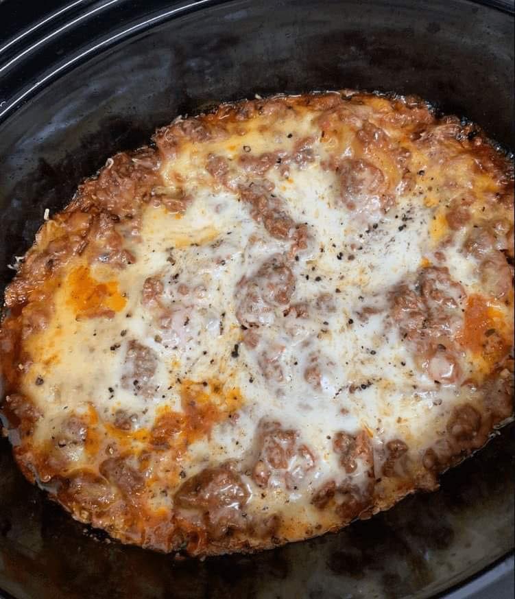 Crockpot Lasagna - Delicious layers of pasta, meat sauce, and cheese cooked in a slow cooker.