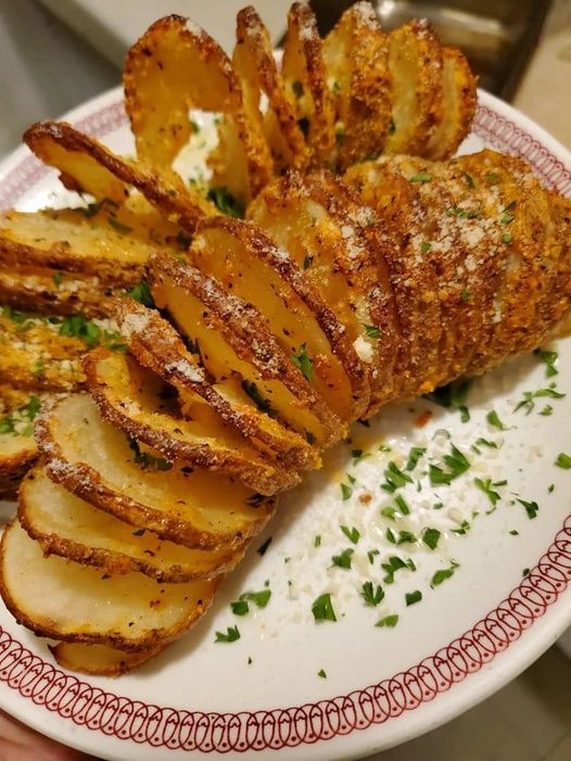 Sliced Baked Potatoes on a Plate