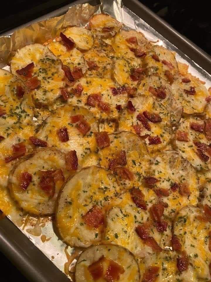 "Golden-brown baked potato rounds topped with crispy bacon and melted cheese"