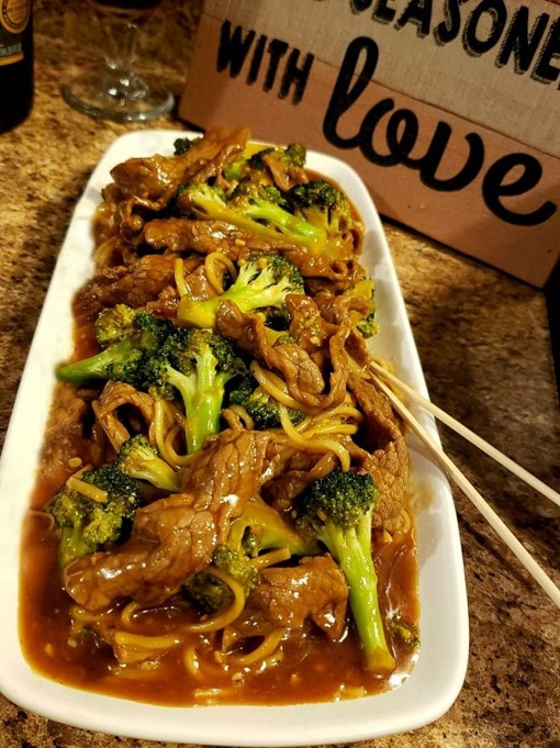 Sliced steak and broccoli stir-fry in a wok, showcasing the delicious Beef and Broccoli recipe."