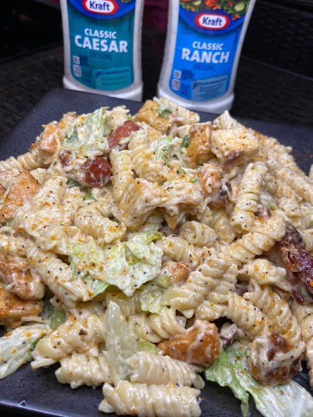 Chicken Caesar Pasta: A delectable blend of seasoned chicken, al dente pasta, and crisp salad, drizzled with homemade Caesar dressing.