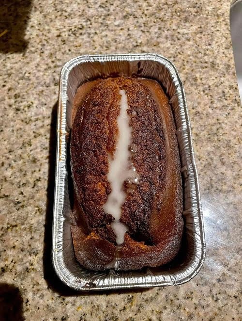 "Homemade Pumpkin Bread: Aromatic blend of spices, farm-fresh ingredients, and a nutty crunch."