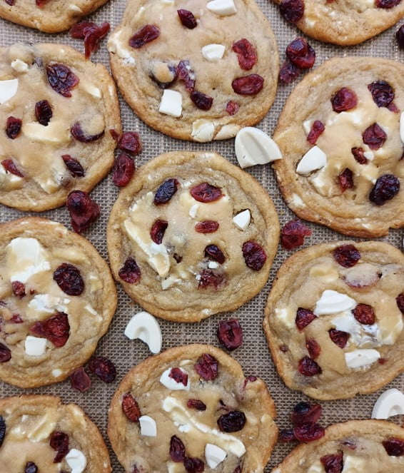 Premium white chocolate cranberry cookies on a baking sheet, showcasing the perfect blend of sweetness and tartness.