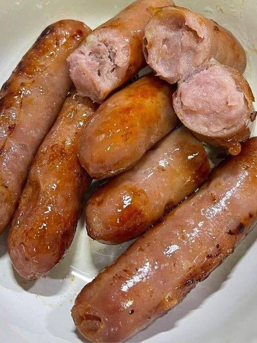 Air-fried sausages in a basket, crispy and golden-brown, showcasing culinary perfection