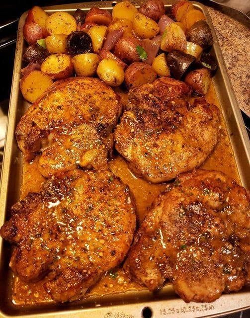 Sheet pan pork chops with multi-colored potatoes and red onion