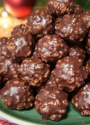 Chocolate Rice Krispie Balls - A plate filled with chocolate-covered rice krispie balls.